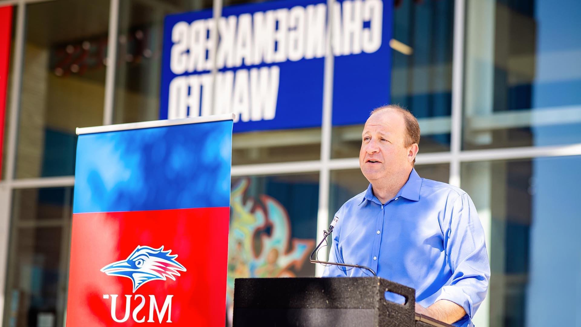 Jared Polis speaking at MSU Denver event.